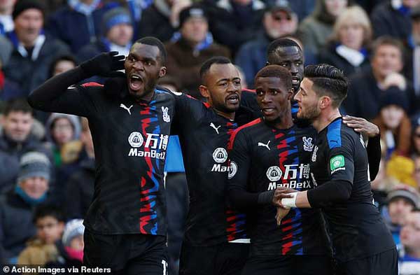 Jordan Ayew (second from left) celebrates his winning goal with teammates