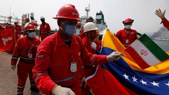 A Venezuelan oil worker holding a small Iranian flag attends a ceremony for the arrival of Iranian oil tanker Fortune at the El Palito refinery near Puerto Cabello, Venezuela, Monday, May 25, 2020.  File image
