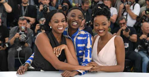 © Loic Venance, AFP | Kenyan director Wanuri Kahiu (left) and actresses Samantha Mugatsia and Sheila Munyiva (right) pose at the Cannes Film Festival on May 9, 2018 during a photocall for the film "Rafiki"