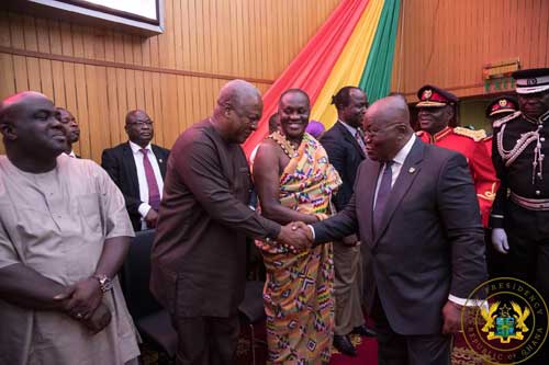 Former President John Mahama (L) exchanges pleasantries with President Akufo-Addo at SoNA 2019