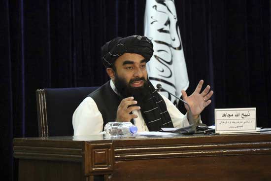 aliban spokesman Zabihullah Mujahid speaks during a press conference in Kabul, Afghanistan Tuesday, Sept. 7, 2021. The Taliban on Tuesday announced a caretaker Cabinet stacked with veterans of their harsh rule in the late 1990s and subsequent 20-year battle against the U.S.-led coalition and its Afghan government allies. The line-up announced at the press conference is not likely to win the international support the Taliban so desperately need to avoid an economic meltdown. (AP Photo/Muhammad Farooq)